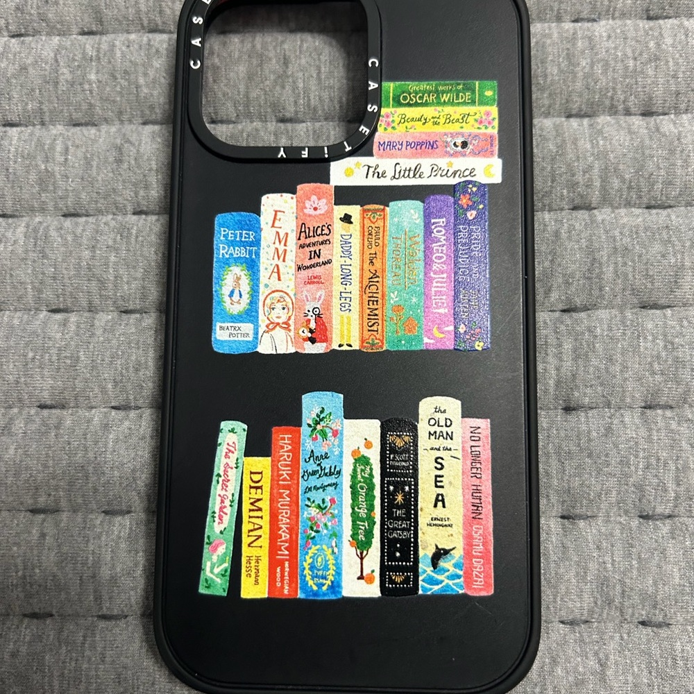 Casetify Black Phone Case with Colorful Illustrated Bookshelf Design
